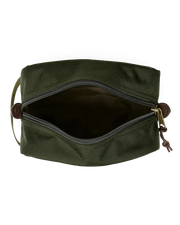 Dark green travel bag with Filson logo against a white background. 