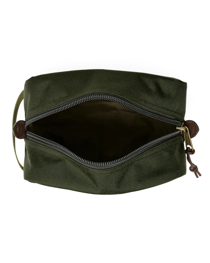 Dark green travel bag with Filson logo against a white background. 