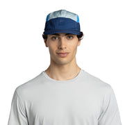 Man wearing a blue and gray cap on a white background