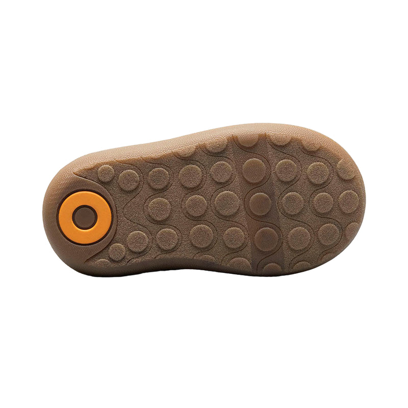 Brown shoe sole with a yellow circular design on a white background