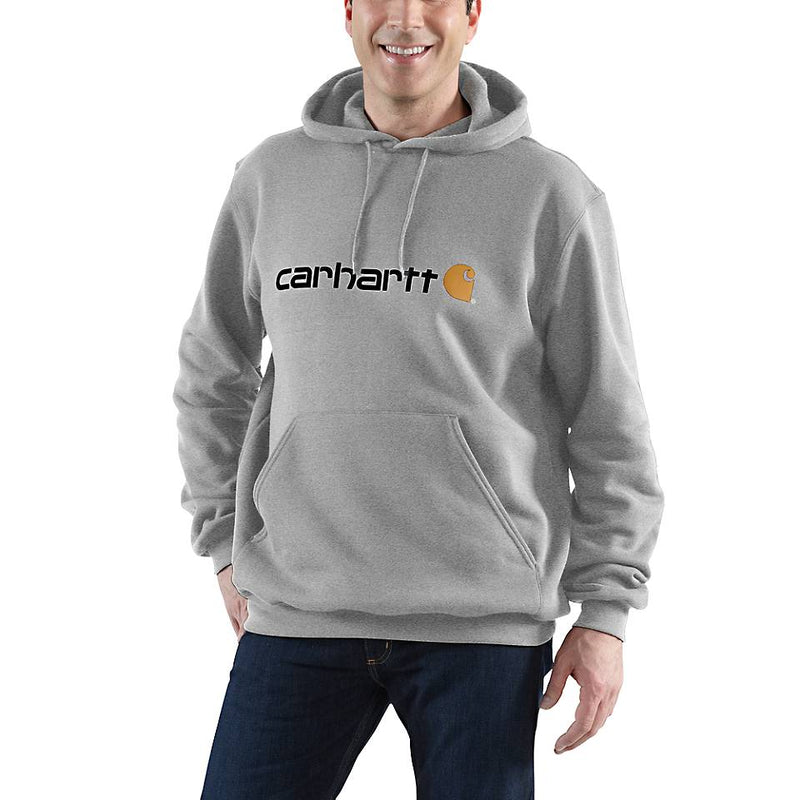Person wearing a gray Carhartt hoodie on a white background