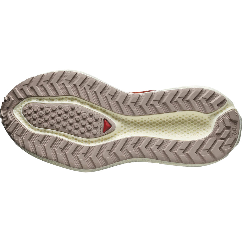 The sole of a Salomon Aero Glide 3 Grvl running shoe, built with chevron treads and gravel-specific features for enhanced trail running experience.