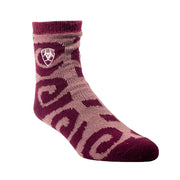 Maroon and pink sock with a logo on a beige background