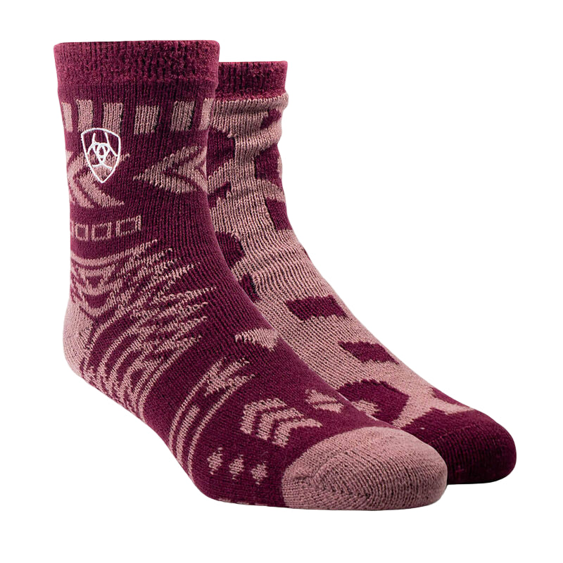 Pair of maroon patterned socks on a beige background