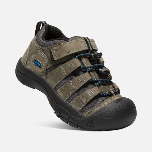 Brown hiking shoe with black sole on a white background