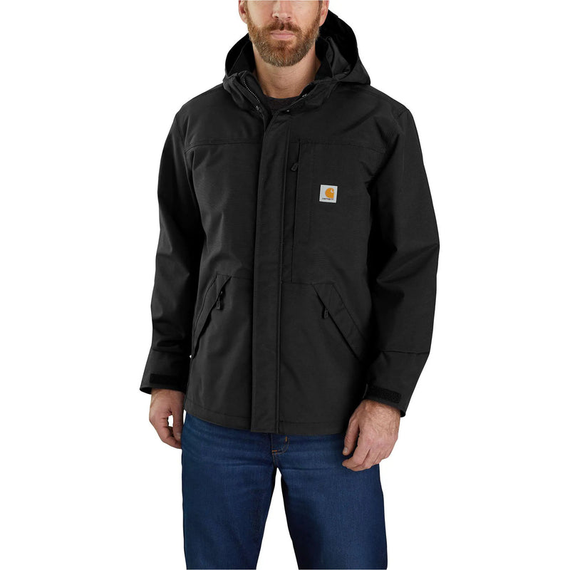 Man wearing a black Carhartt jacket on a white background