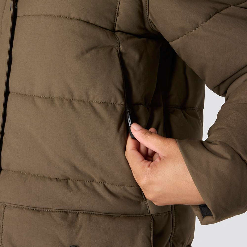 Hand unzipping the pocket of a tarmac brown colored parka.