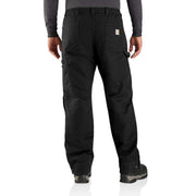 Man wearing a pair of loose fitting black work pants against a white background. There are two pockets and a Carhartt logo on the rear, as well as two pockets on either leg of the pants.