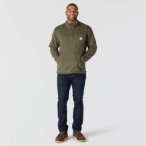 Full body man wearing an olive colored fleece jacket with chest pocket and zipper pouch on a white background
