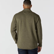 Back of man wearing an olive colored fleece jacket against a white background
