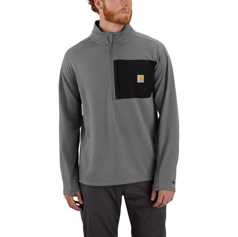 Man wearing a gray long-sleeve shirt with a black pocket on a white background