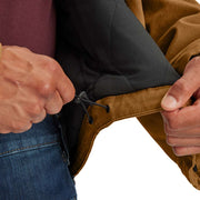 Man showing off a tassel at the bottom of a brown colored duck-lined insulated jacket against a white background.