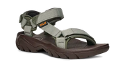 Dark brown sandal with green straps on a white background.