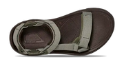 Brown sandal with green straps on a white background.