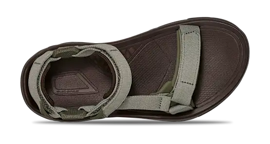 Brown sandal with green straps on a white background.