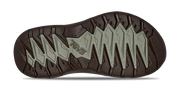 Close-up of a shoe sole with brand logo on a white background