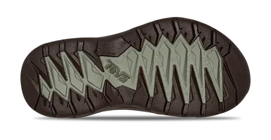 Close-up of a shoe sole with brand logo on a white background