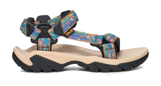 Side view of a tan sandal with colorful straps on a white background.
