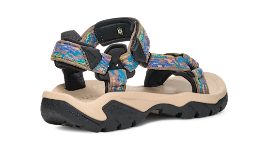 Side view of a tan sandal with colorful straps on a white background.