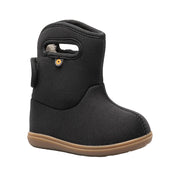 Black child's boot with a brown sole on a white background