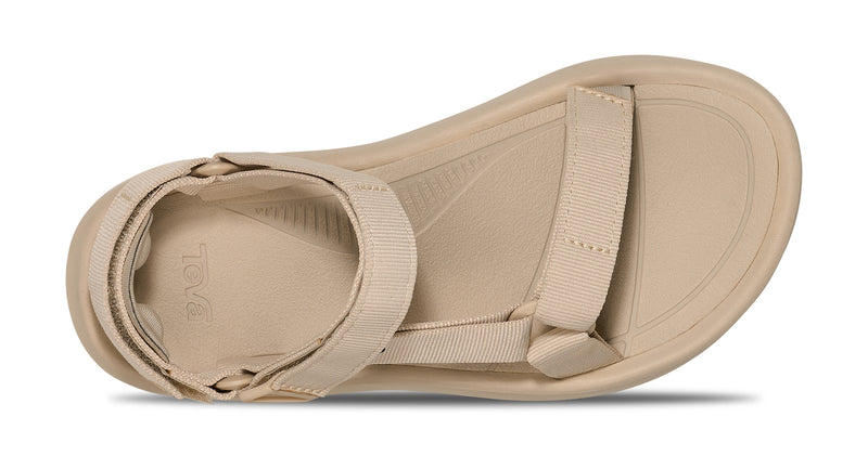 Beige sandal with straps on a white background.