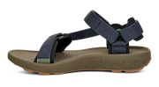 Side view of a dark green sandal with blue straps on a white background.