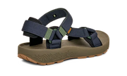 Side view of a ark green sandal with blue straps on a white background.