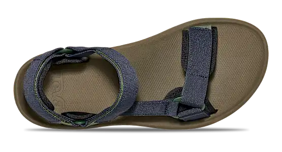 Dark green sandal with blue straps on a white background.