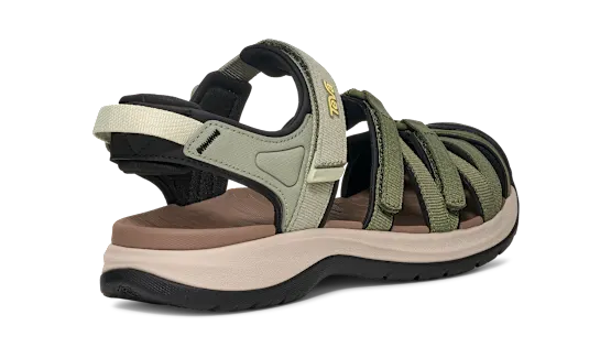 Side view of a green and tan sandal on a white background.