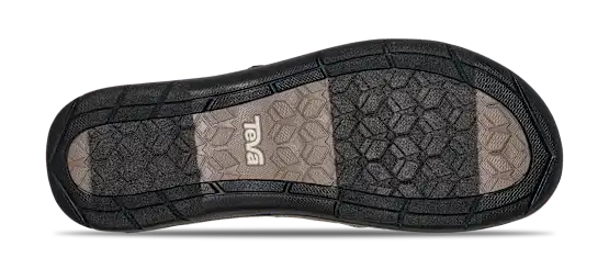 Close-up of a shoe sole with brand logo on a white background