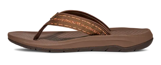 Side view of a brown flip flop on a white background.