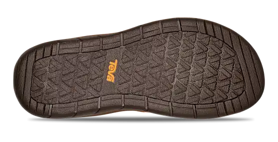 Bottom tread of a shoe with a Teva logo on a white background.