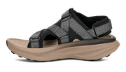 Side view of a tan sandal with grey and black straps on a white background.