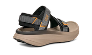 Side view of a tan sandal with grey and black straps on a white background.