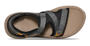 Tan sandal with black and grey straps on a white background.