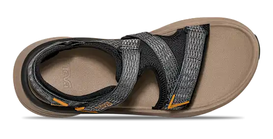 Tan sandal with black and grey straps on a white background.