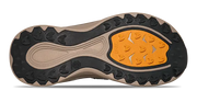 Close-up of a shoe sole with orange tread pattern on a white background