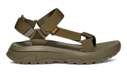 Side view of a dark green sandal on a white background.