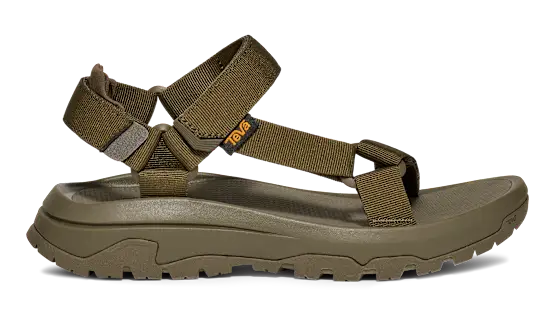 Side view of a dark green sandal on a white background.