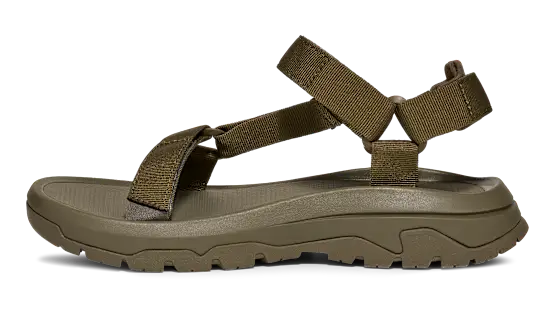 Side view of a dark green sandal on a white background.