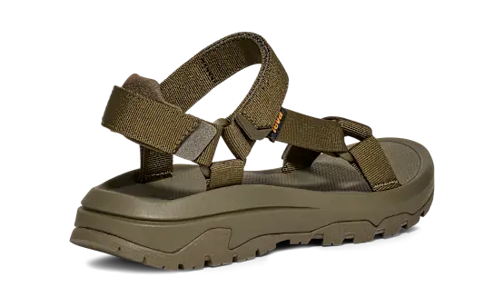Side view of a dark green sandal on a white background.