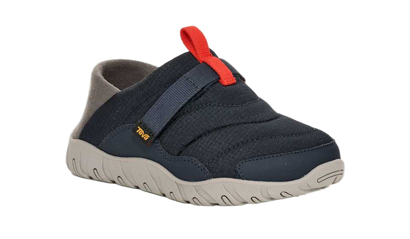 Navy slip-on shoe with red pull tab on a white background