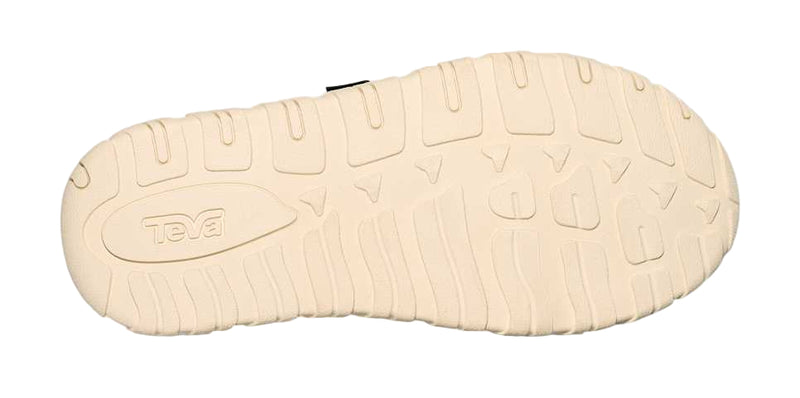 Close-up of a beige shoe sole with 'Teva' branding on a white background
