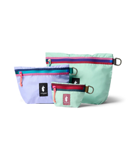 A small teal, medium purple, and large teal pouches