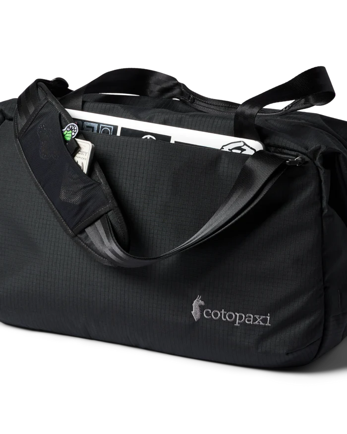 A black duffel bag with a laptop inside