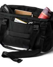 A black duffel bag with gear inside