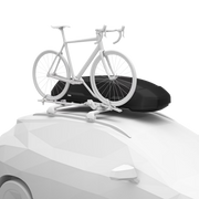 Black cargo roof rack on top of a white car with a white bike attached against a white background. 