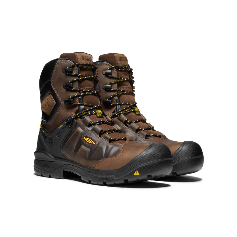 Side view of a pair of brown and black work boots with yellow accents against a white background. 