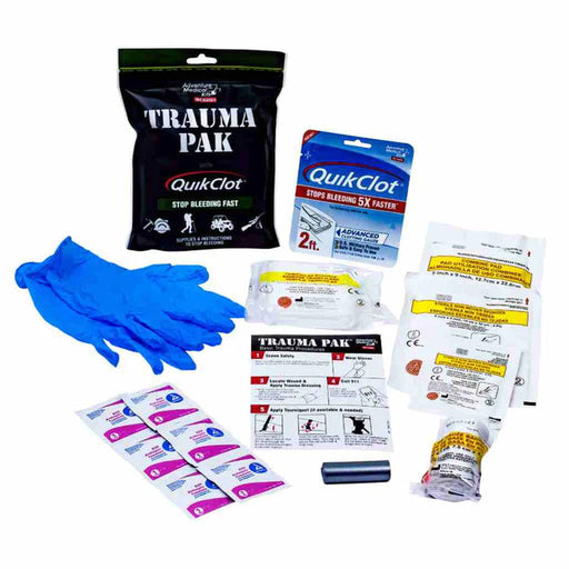 All the materials in the trauma pak laying out on a white background