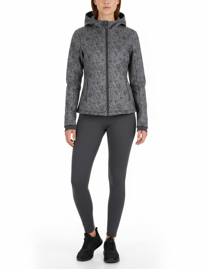 Black and grey floral print soft shell jacket worn by a model with dark grey leggings and black sneakers